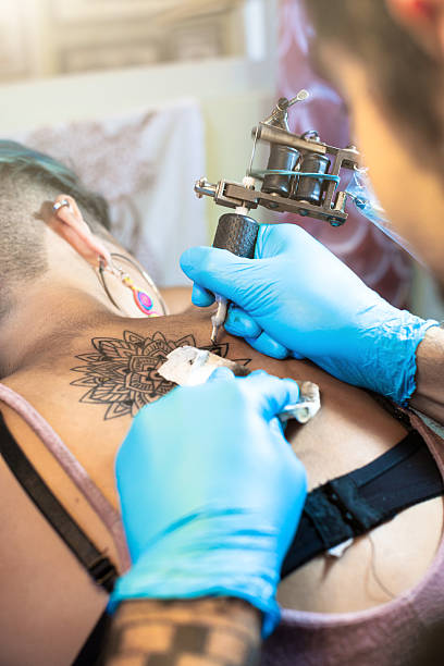 istock Tattoo artist at work - close up 483179892