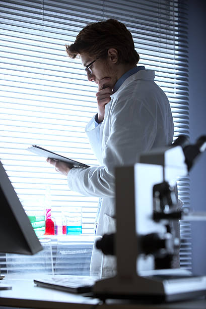 istock Researcher reading medical records 483183247
