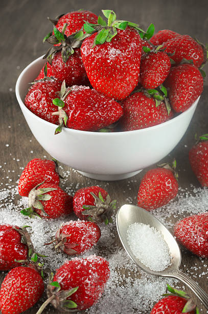 istock Strawberries in bowl with sugar 483183390