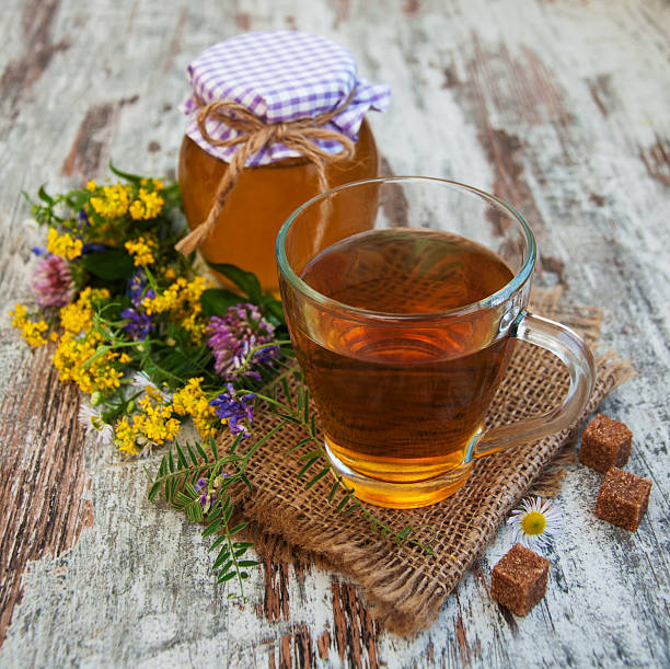 istock Cup of tea, honey and flowers 483184136