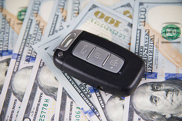 istock Car key on a background of dollars 483185730