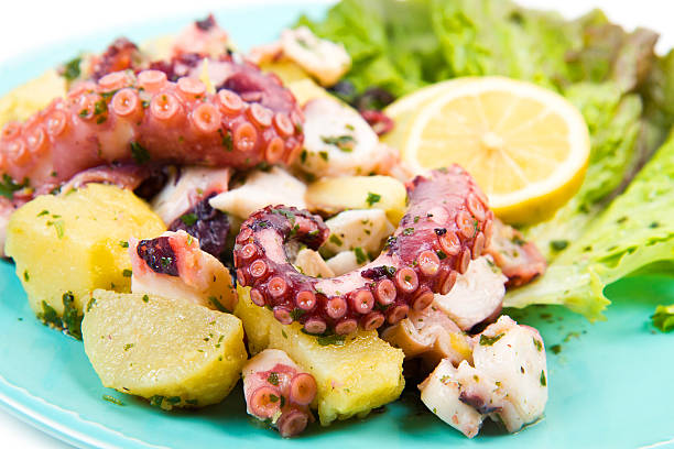 octopus salad with potatoes octopus salad with potatoes seafood salad stock pictures, royalty-free photos & images
