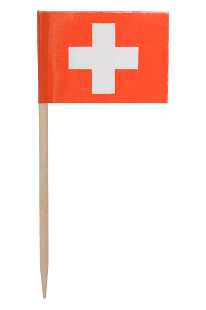 Swiss flag toothpick (XL) One of those tiny flags on a toothpick. This one is the flag of Switzerland. Isolated on a pure white background. toothpick stock pictures, royalty-free photos & images