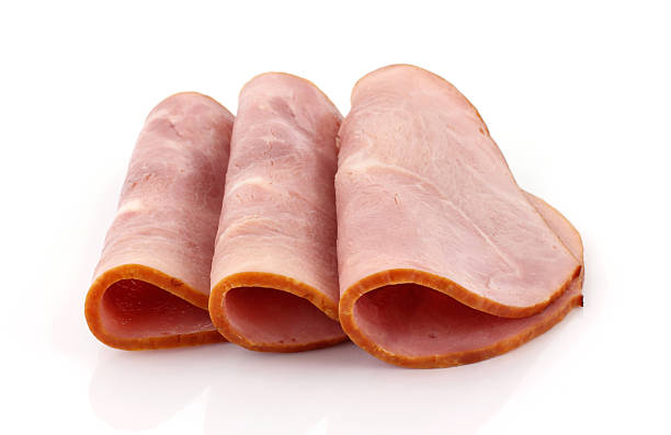 istock Three slices of baked ham folded in half 483188169