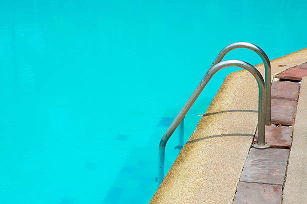 istock Grab bars ladder in the blue swimming pool 483189645