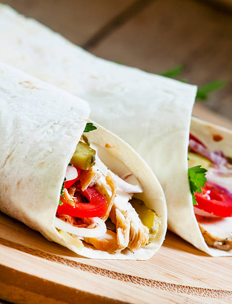 istock Shawarma, turkish doner kebab, roll with meat and pita bread 483190316