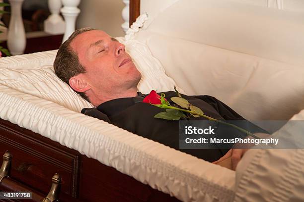 Presenting A Rose Stock Photo - Download Image Now - Coffin, Men, Dead Person