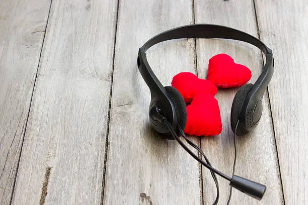 love music,Headphones and heart on the wooden floor
