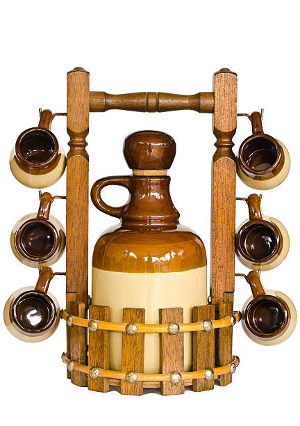 Bottle and glasses for drinking in a wooden box