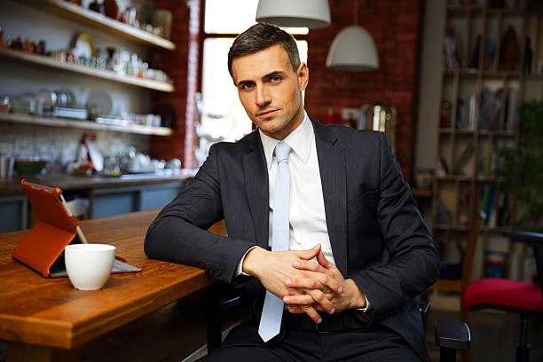 istock businessman in formal cloths drinking coffee 483201751
