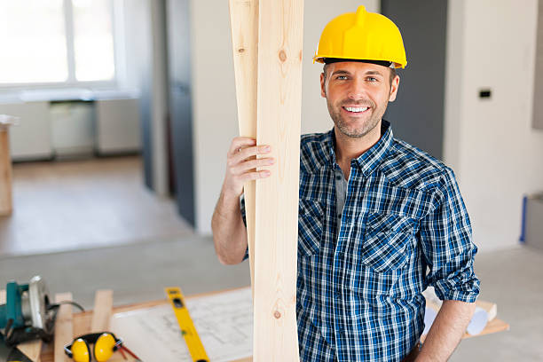 Portrait of happy and handsome carpenter