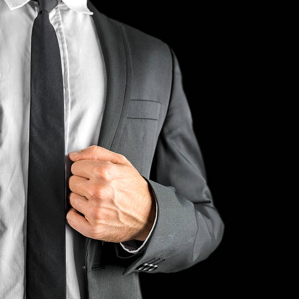 istock Businessman holding the lapel of his jacket 483202577
