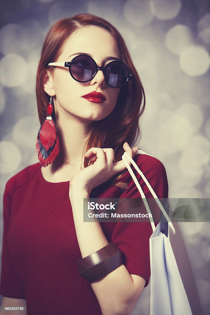 Beautiful redhead women with shopping bag Abstract Stock Photo