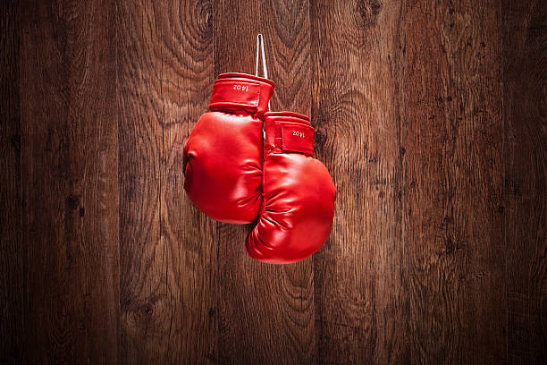 istock Pair of boxing gloves hanging on a wall 483203011