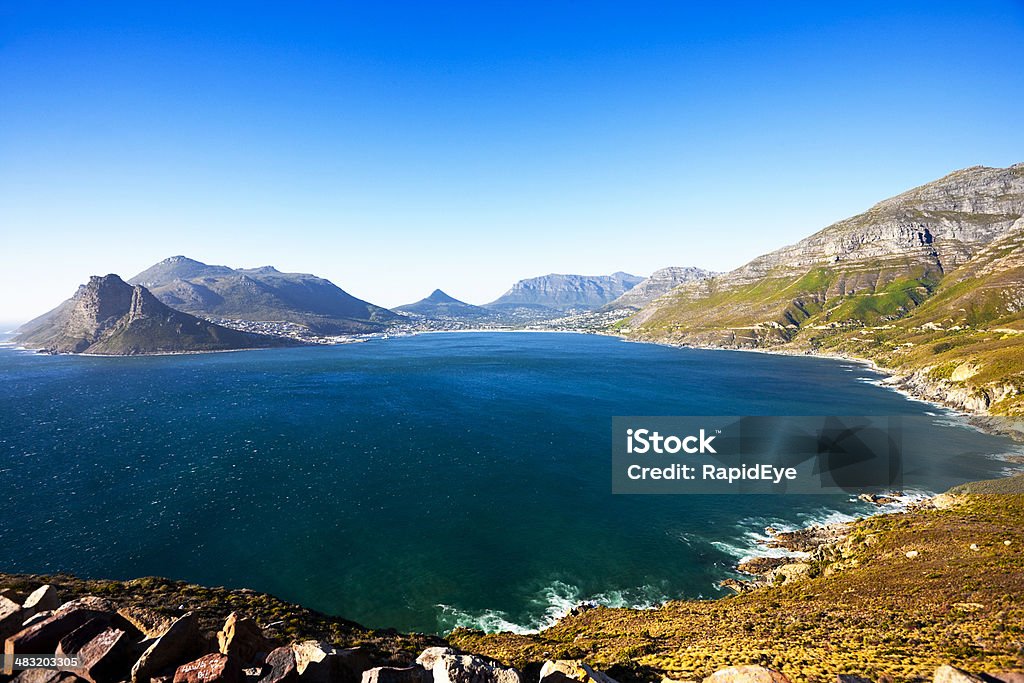 Cape Town's beautiful Hout Bay from Chapman's Peak Shot in wide angle from the iconic Chapman's Peak Drive, Hout Bay nestles among sheltering mountains. Shot with Canon 1Ds Mark III. Africa Stock Photo