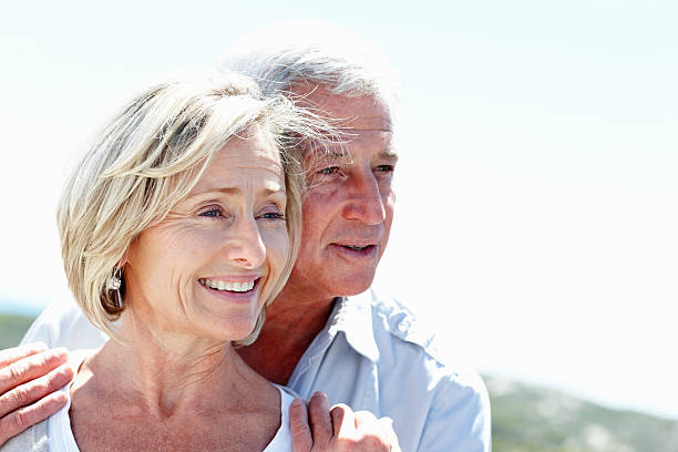 istock Lovely senior couple in love looking at copyspace 483203571