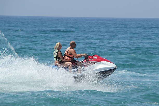 istock young couple haveing fun on jet ski 483204088
