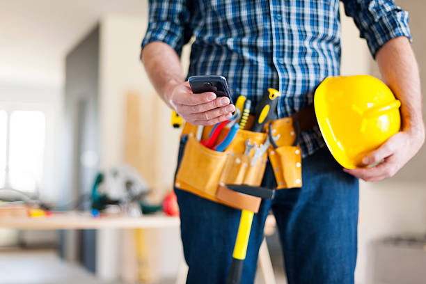 istock Close up of construction worker with mobile phone 483204695