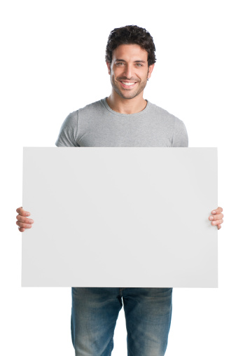 Happy young man showing and displaying placard ready for your text or product.