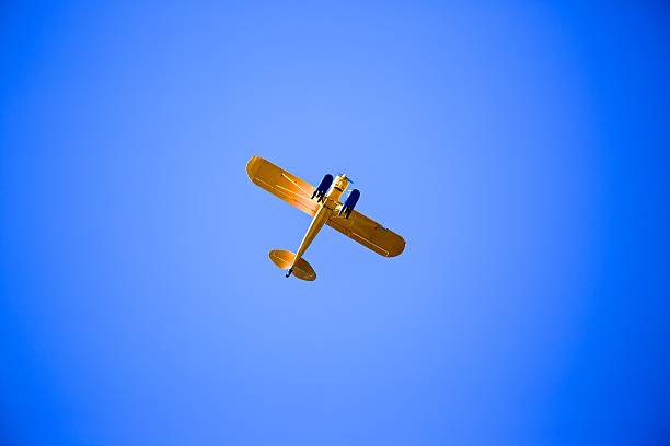 istock Yellow Propeller Plane in the Sky 483205097