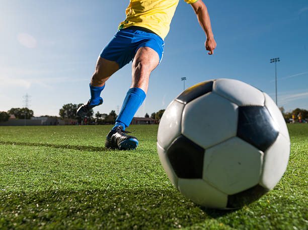 istock Soccer Player Kicking a Ball 483205131