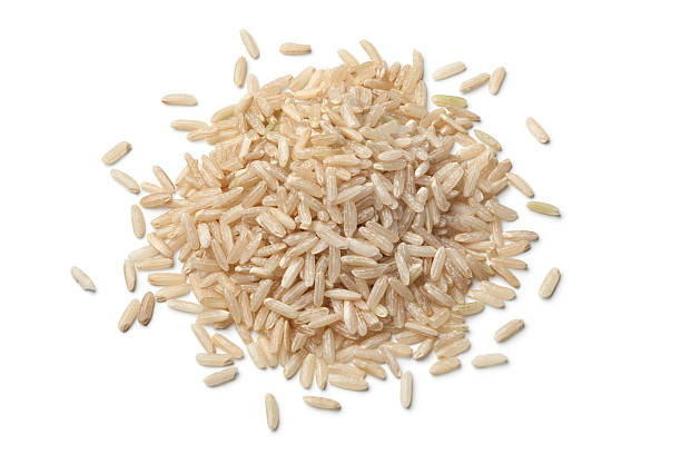 mucchio di crudo riso marrone - brown rice rice healthy eating organic foto e immagini stock