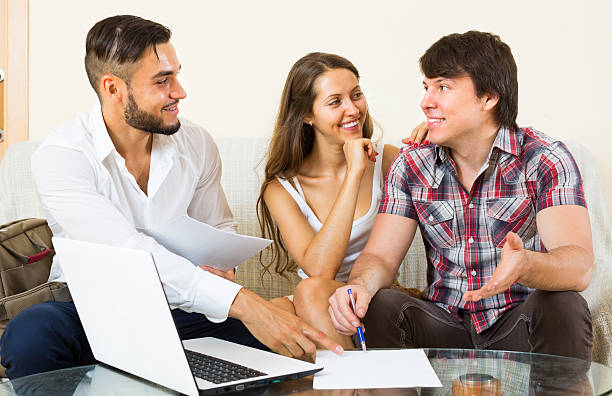 istock salesman try to sign contract with couple 483206068