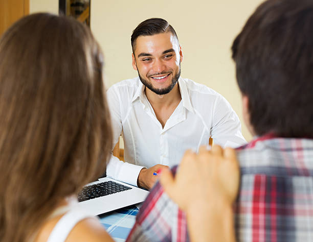 istock Couple and salesman talking 483206092