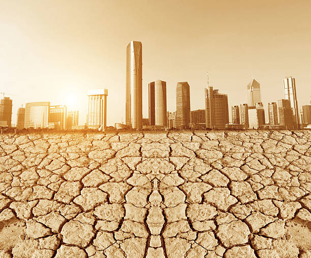 istock city looks over a cracked earth landscape 483207518