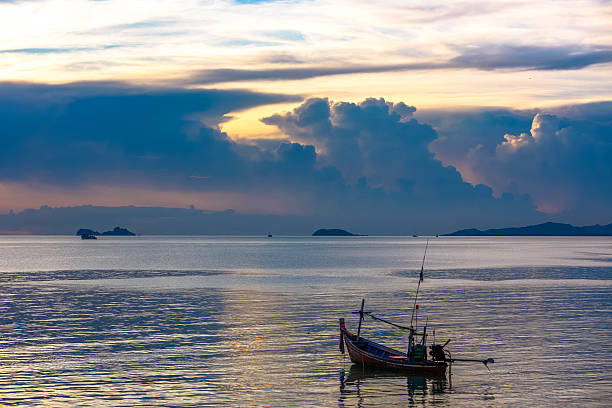 Fishing boat in sea on Koh Samui at amazing sunset Fishing boat in sea on Koh Samui at amazing sunset. Thailand dogger stock pictures, royalty-free photos & images