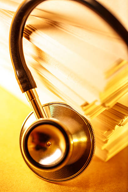 istock Stethoscope and heap of paper cards 483214976