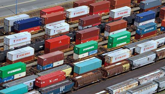 Seattle, USA - Jun 8, 2023: Late in the day Amazon rail cars roll through downtown on the waterfront.