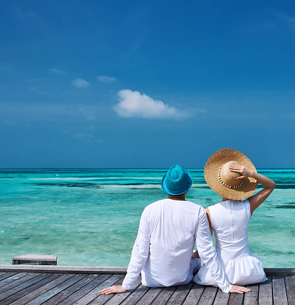 istock Couple on a beach jetty at Maldives 483226947