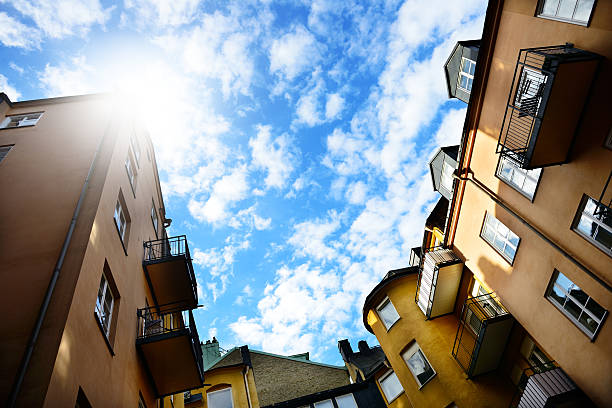 Modern flats in old classic building against deep blue sky in Stockholm, Sweden.
