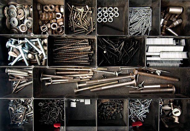 Organized nails, bolts and screws Objects; Organized nails, bolts and screws bolt fastener photos stock pictures, royalty-free photos & images