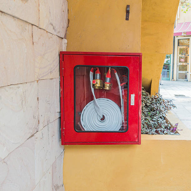 istock fire extinguisher and hose in the wall 483228631