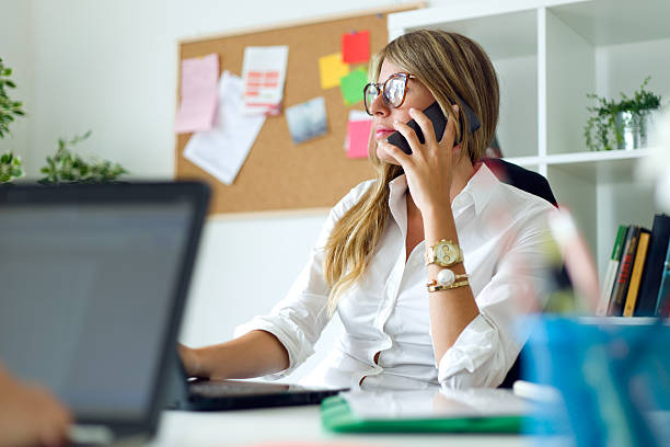 istock Business woman working with mobile phone in her office. 483229364