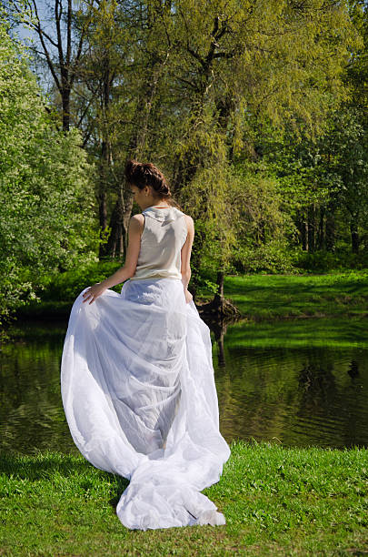 istock young beautiful woman walks through park 483229880