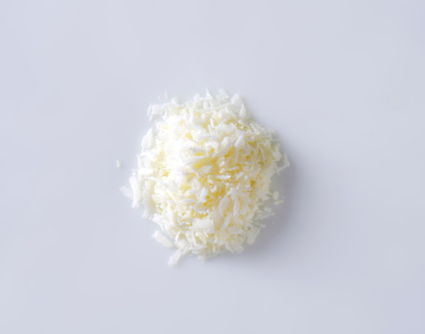 handful of grated coonut on white background