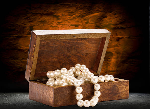 istock Wooden chest with white pearl necklace 483230360