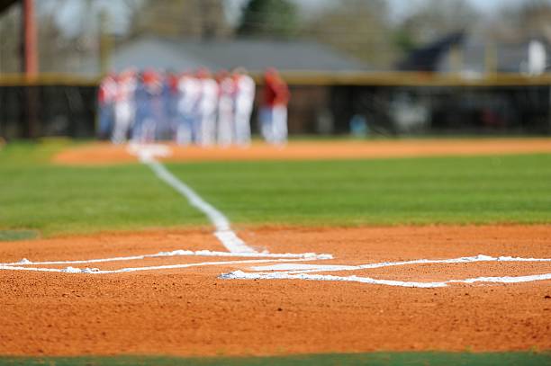 istock Home plate with team preparing to play 483230571