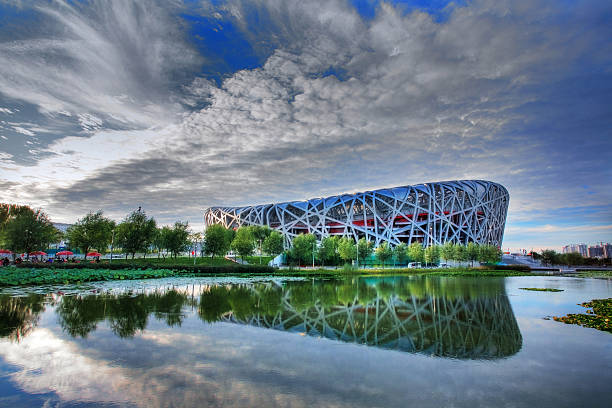 China National Olympic Stadium Beijing,CHINA-Sep 7,2009:The beijing Olympic statium with blue sky  and its reflection in the pool. Beijing Olympic game in 2008 is the most expensive one in the history. beijing olympic stadium photos stock pictures, royalty-free photos & images