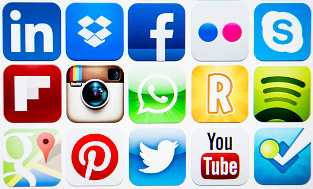 Vector set of social media icons Florence, Italy - February 17, 2013: Close up of lcd with the most famous social media and downloaded app on the Apple Itunes webstore. These icons are part of some categories like social media , photography, navigation and utilities  .  The icon listed are Pinterest, Facebook, Skype, Flickr, Youtube, Instagram, spotify, linkedin, dropbox, ruzzle,whatsup,gmail, twitter,foursquare. Studio shot image. Flickr stock pictures, royalty-free photos & images