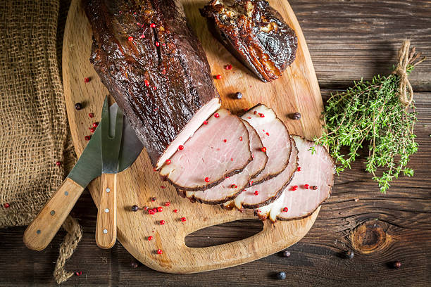 istock Freshly smoked ham in homemade smokehouse 483233513