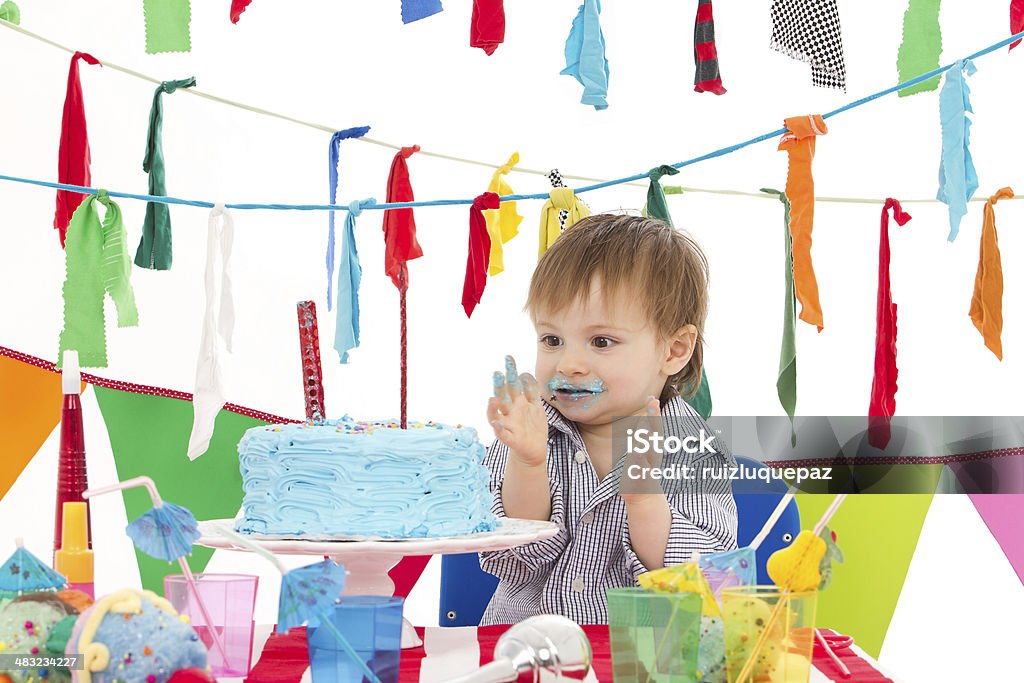 Happy and colorful birthday Boy celebrating at birthday's party blowing birthday candles Balloon Stock Photo