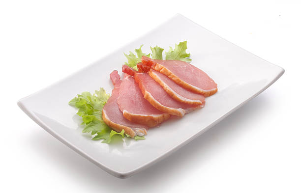 istock Slices of pork balyk on the plate 483236424