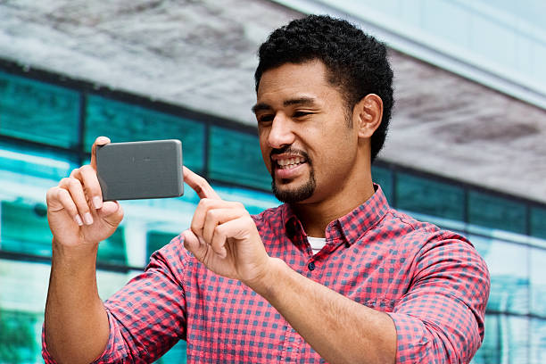 istock Smiling casual man taking a selfie 483244794