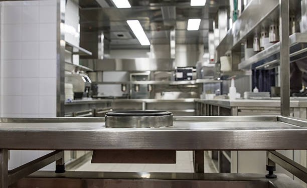 istock Professional kitchen , view counter in steel . Bokeh . 483252808
