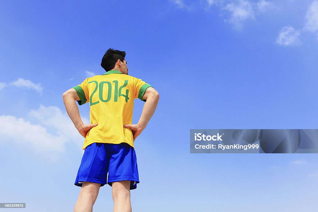 Lets play soccer now Brazilian soccer player with 2014 shirt with blue sky 2014 Stock Photo