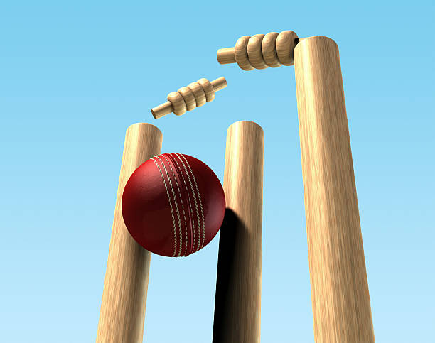 Cricket Ball Hitting Wickets A red leather cricket ball hitting wooden cricket wickets cricket stump photos stock pictures, royalty-free photos & images